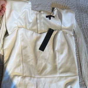 NWT white dress with fringes on arms.